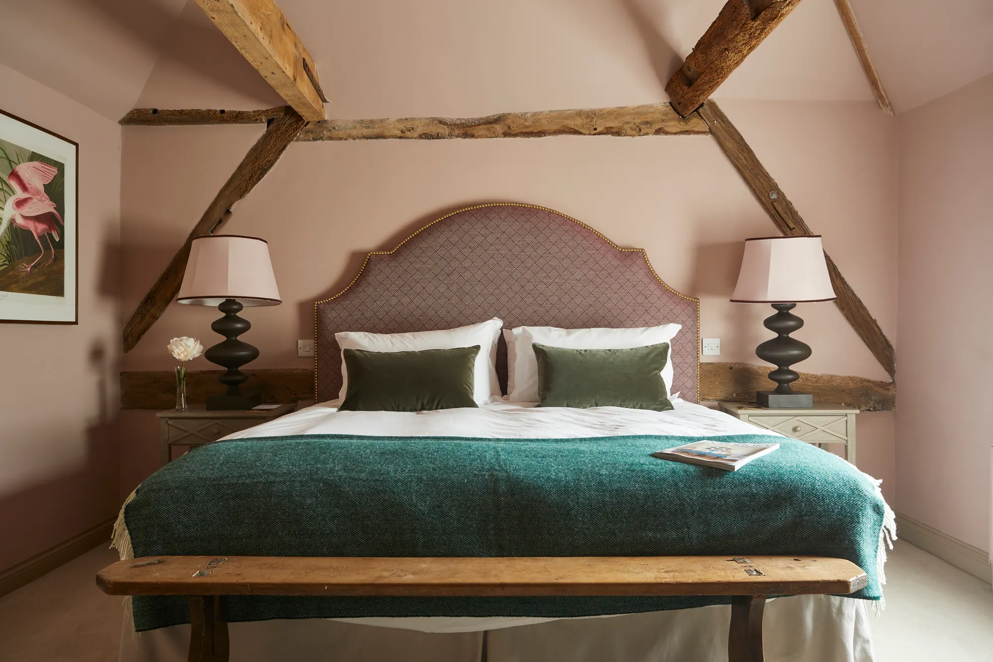 Wansdyke: soft plaster walls under exposed beams with a green throw